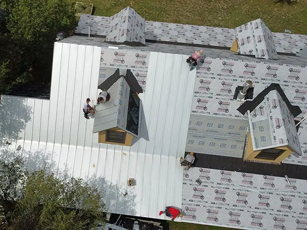 Crew installing a new metal roof